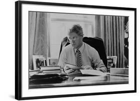 Informal Portrait of President Bill Clinton at His Desk in the Oval Office-null-Framed Photo