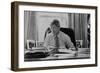 Informal Portrait of President Bill Clinton at His Desk in the Oval Office-null-Framed Photo