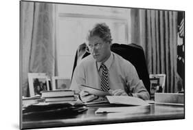 Informal Portrait of President Bill Clinton at His Desk in the Oval Office-null-Mounted Photo