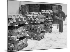 Ingot of Magnesium, Part of the U.S. Strategic Materials Stockpile, Stacked and Covered with Snow-Ed Clark-Mounted Premium Photographic Print