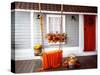 Interior of an Autumn Patio. Swing is Adorned with Autumn Leaves and Orange Knitted Plaid. Basket W-null-Stretched Canvas