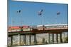 International border of Mexico & the United States, with flags and walking bridge connecting El...-null-Mounted Photographic Print