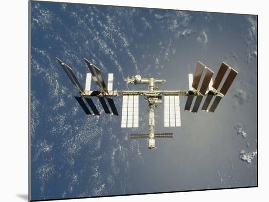 International Space Station Backdropped Against Earth-null-Mounted Photographic Print