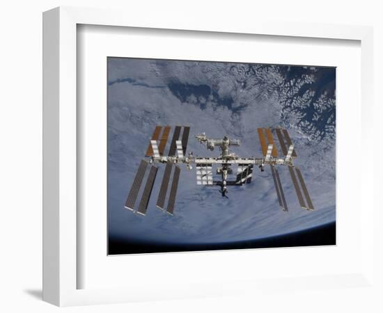 International Space Station Set Against the Background of a Cloud Covered Earth-null-Framed Photographic Print