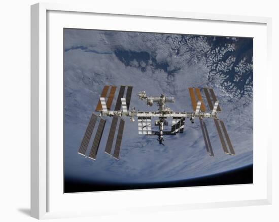 International Space Station Set Against the Background of a Cloud Covered Earth-null-Framed Photographic Print