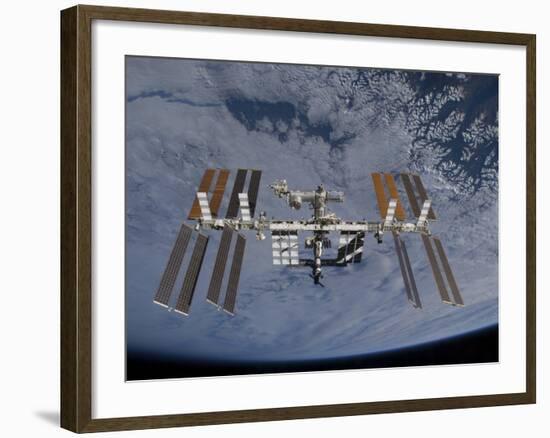 International Space Station Set Against the Background of a Cloud Covered Earth-null-Framed Photographic Print