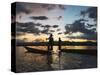 Intha fisherman rowing boat with leg at sunset on Inle Lake, Shan State, Myanmar-Keren Su-Stretched Canvas