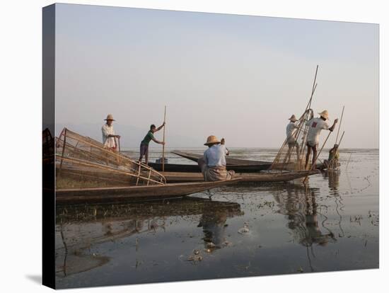 Intha Leg Rowing Fishermen at Dusk, Inle Lake, Nyaungshwe, Shan State, Myanmar (Burma), Asia-Stephen Studd-Stretched Canvas