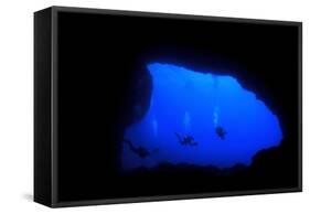 Into Darkness: Underwater Cave Scuba Diving Silhouettes-Rich Carey-Framed Stretched Canvas