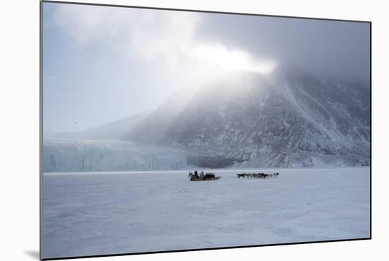 Inuit Hunter and His Dog Team Travelling on the Sea Ice, Greenland, Denmark, Polar Regions-Louise Murray-Mounted Photographic Print