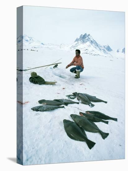 Inuit Man Fishing for Halibut, Greenland, Polar Regions-Jack Jackson-Stretched Canvas