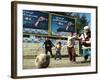 Iraqi Boys Play Soccer Below the Poster Reading "To Grant Iraqi Children Better Iraq"-null-Framed Photographic Print