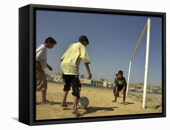 Iraqi Boys Play Soccer in a Baghdad Neighborhood-null-Framed Stretched Canvas