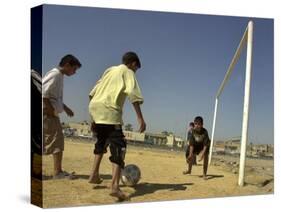 Iraqi Boys Play Soccer in a Baghdad Neighborhood-null-Stretched Canvas