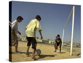Iraqi Boys Play Soccer in a Baghdad Neighborhood-null-Stretched Canvas
