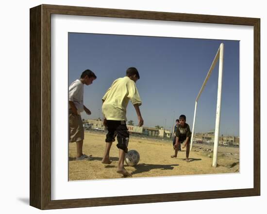 Iraqi Boys Play Soccer in a Baghdad Neighborhood-null-Framed Photographic Print