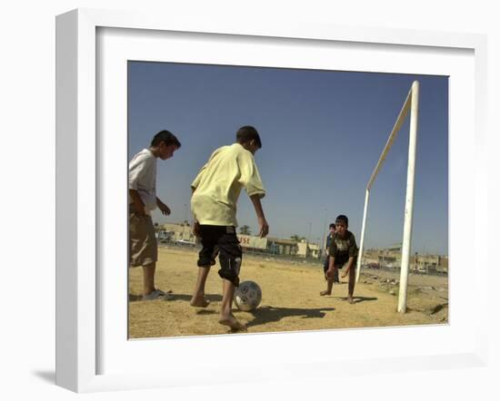 Iraqi Boys Play Soccer in a Baghdad Neighborhood-null-Framed Photographic Print