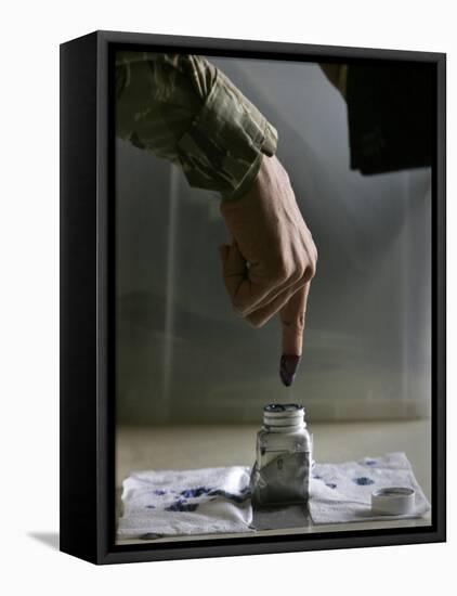 Iraqi Security Forces Member Inks His Finger after Casting His Vote at a Polling Center in Iraq-null-Framed Stretched Canvas