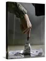 Iraqi Security Forces Member Inks His Finger after Casting His Vote at a Polling Center in Iraq-null-Stretched Canvas