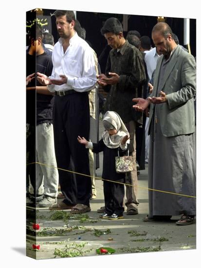 Iraqis, Inluding a Little Girl, Pause to Pray-null-Stretched Canvas