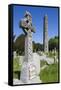 Ireland, County Wicklow, Glendalough, Celtic cross and Round Tower-Walter Bibikow-Framed Stretched Canvas