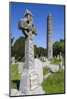 Ireland, County Wicklow, Glendalough, Celtic cross and Round Tower-Walter Bibikow-Mounted Photographic Print