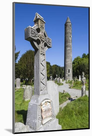 Ireland, County Wicklow, Glendalough, Celtic cross and Round Tower-Walter Bibikow-Mounted Photographic Print