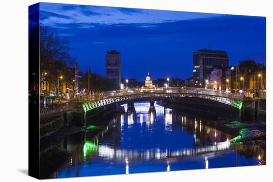 Ireland, Dublin, Ha'Penny Bridge over the River Liffey, dawn-Walter Bibikow-Stretched Canvas