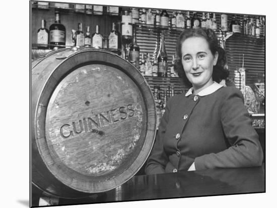 Irish Barmaid at Airport Bar with Keg of Guinness Beer-Nat Farbman-Mounted Premium Photographic Print