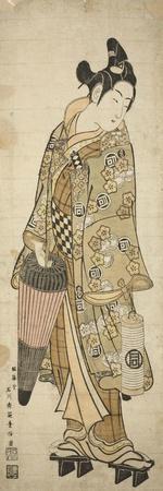 The Actor Sanogawa Ichimatsu I as a young man holding an umbrella and a lantern, c.1748