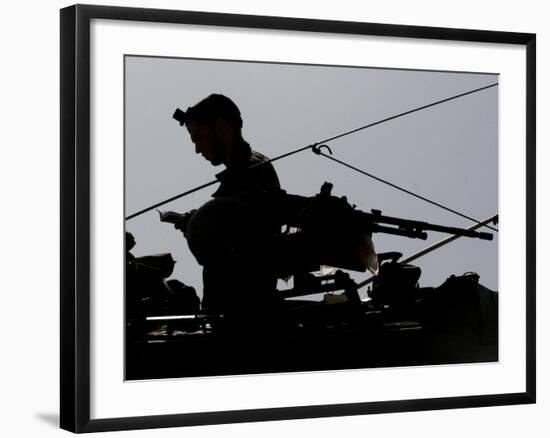 Israeli Soldier Prays on Top of a Tank Just Outside the Southern Gaza Strip-null-Framed Photographic Print