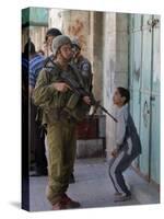 Israeli Soldier Tells a Palestinian Boy to Leave the Scene Following a Knife Attack-null-Stretched Canvas