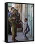 Israeli Soldier Tells a Palestinian Boy to Leave the Scene Following a Knife Attack-null-Framed Stretched Canvas