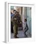 Israeli Soldier Tells a Palestinian Boy to Leave the Scene Following a Knife Attack-null-Framed Photographic Print