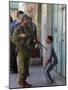 Israeli Soldier Tells a Palestinian Boy to Leave the Scene Following a Knife Attack-null-Mounted Photographic Print