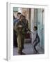 Israeli Soldier Tells a Palestinian Boy to Leave the Scene Following a Knife Attack-null-Framed Photographic Print