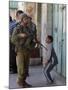 Israeli Soldier Tells a Palestinian Boy to Leave the Scene Following a Knife Attack-null-Mounted Photographic Print