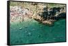 Italia, Apulia, Polignano a Mare. Crowded beach on a weekend. green.-Michele Molinari-Framed Stretched Canvas