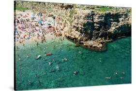 Italia, Apulia, Polignano a Mare. Crowded beach on a weekend. green.-Michele Molinari-Stretched Canvas