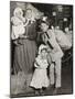Italian Family Seeking Lost Baggage, Ellis Island, 1905-Lewis Wickes Hine-Mounted Photographic Print