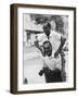 Italian Man Leaping Onto a Friend's Back in Casual Greeting While Crossing a Piazza-Paul Schutzer-Framed Photographic Print