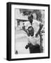 Italian Man Leaping Onto a Friend's Back in Casual Greeting While Crossing a Piazza-Paul Schutzer-Framed Photographic Print