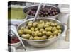 Italy, Florence. Dishes of olives in the Central Market, Mercato Centrale in Florence.-Julie Eggers-Stretched Canvas