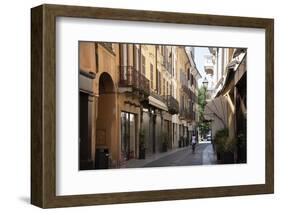 Italy, Lombardy, Cremona, cobblestone street with bicycles and old buildings-Alan Klehr-Framed Photographic Print