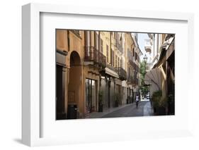 Italy, Lombardy, Cremona, cobblestone street with bicycles and old buildings-Alan Klehr-Framed Photographic Print