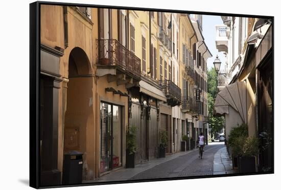 Italy, Lombardy, Cremona, cobblestone street with bicycles and old buildings-Alan Klehr-Framed Stretched Canvas