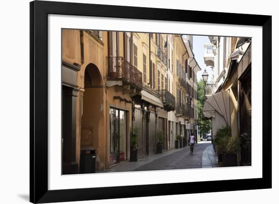 Italy, Lombardy, Cremona, cobblestone street with bicycles and old buildings-Alan Klehr-Framed Photographic Print