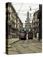 Italy, Lombardy, Milan, Milan Trams on Via Orefici with Castello Sforzesco, Dawn-Walter Bibikow-Stretched Canvas