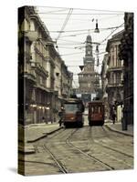 Italy, Lombardy, Milan, Milan Trams on Via Orefici with Castello Sforzesco, Dawn-Walter Bibikow-Stretched Canvas