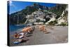 Italy, Positano, Sunbathers at the beach in the Town of Positano.-Terry Eggers-Stretched Canvas